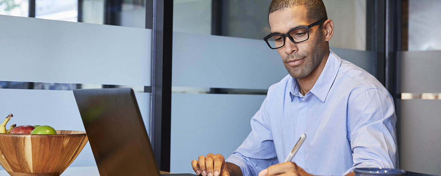 Man working on laptop at desk